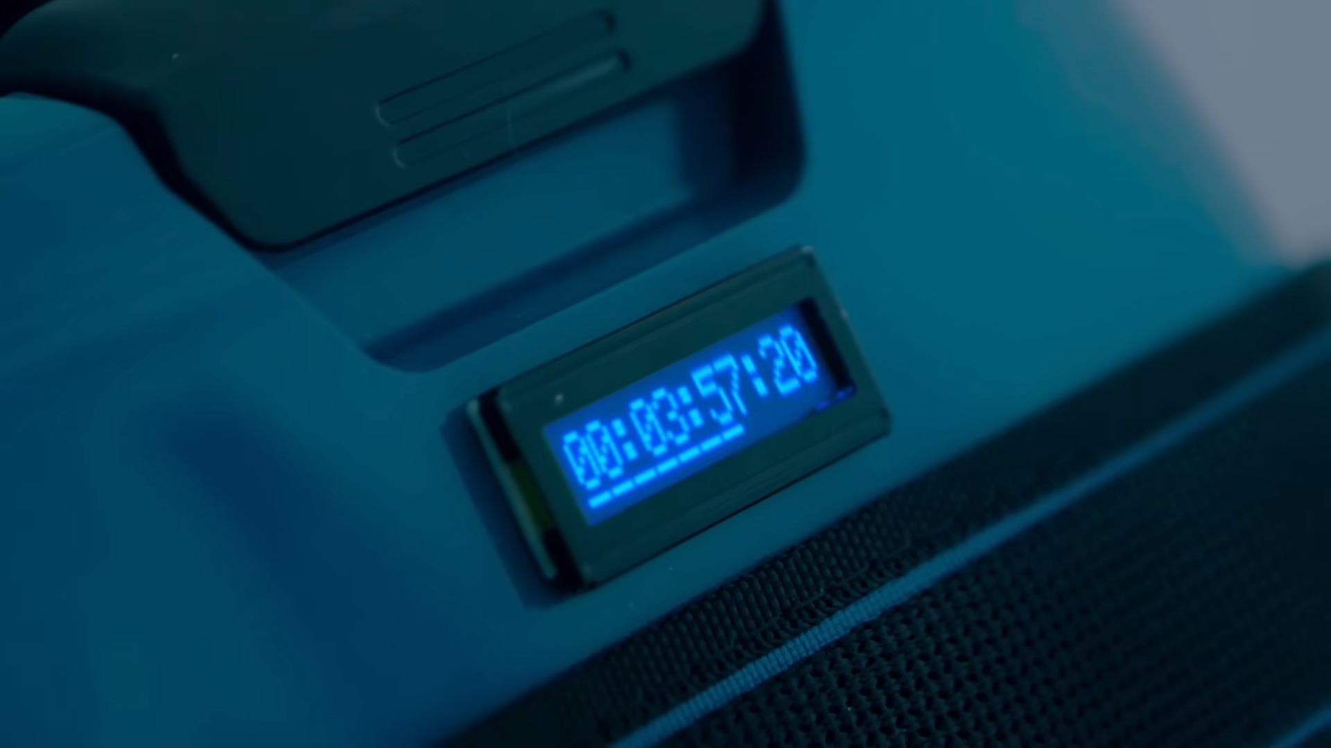 The backpack's screen showing a timer displaying 3 minutes and 57 seconds.